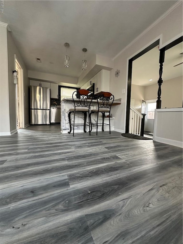 2800 Candlewood Cir, Chesapeake, VA 23324 - unfurnished living room with dark wood-type flooring, baseboards, and crown molding