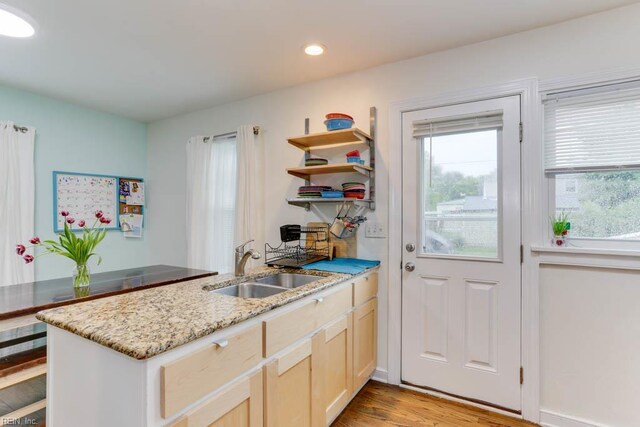 8140 Kenwood Dr, Norfolk, VA 23518 - kitchen featuring a sink, a peninsula, recessed lighting, light stone countertops, and light wood-type flooring