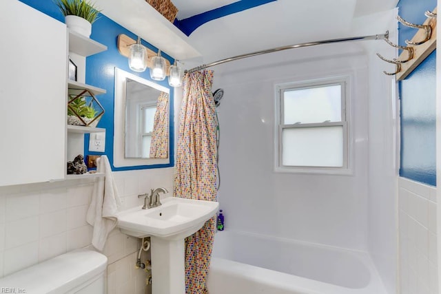 8140 Kenwood Dr, Norfolk, VA 23518 - bathroom with tile walls, toilet, shower / tub combo, and wainscoting