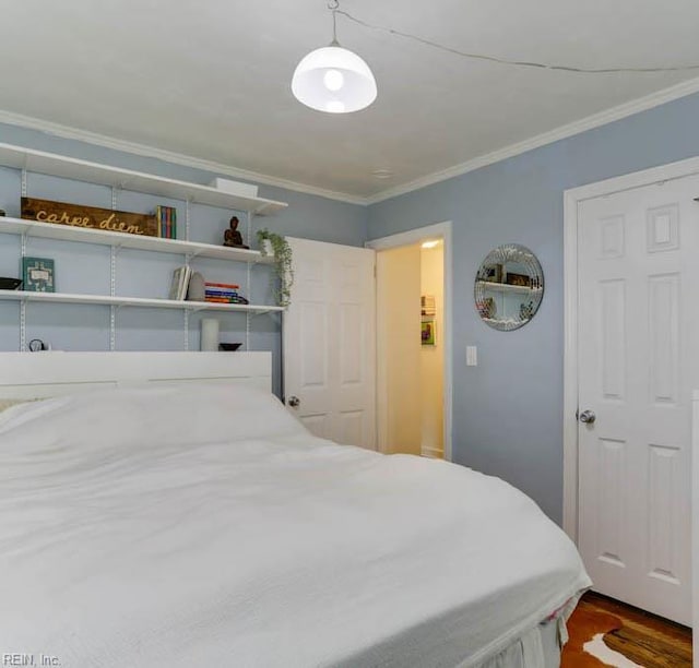 8140 Kenwood Dr, Norfolk, VA 23518 - bedroom with crown molding and dark wood-type flooring