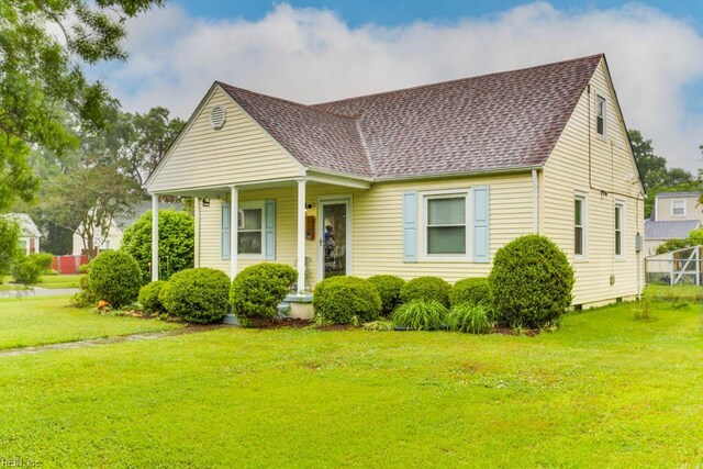8140 Kenwood Dr, Norfolk, VA 23518 - view of front facade featuring a shingled roof and a front lawn