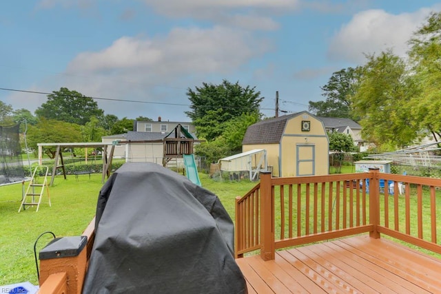 8140 Kenwood Dr, Norfolk, VA 23518 - deck featuring a shed, a playground, a trampoline, and an outbuilding