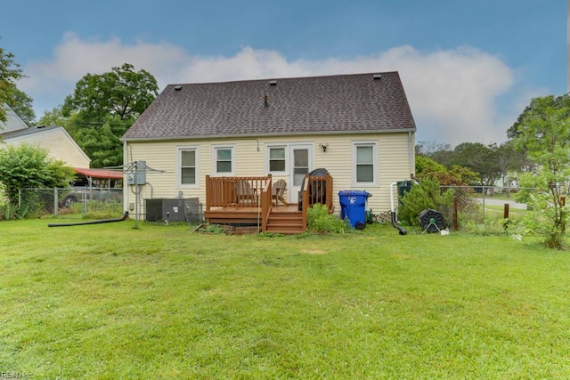 8140 Kenwood Dr, Norfolk, VA 23518 - back of property with a deck, roof with shingles, and central AC unit