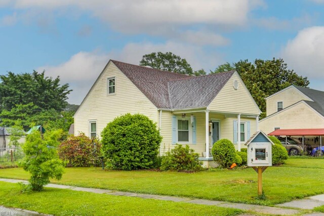 8140 Kenwood Dr, Norfolk, VA 23518 - bungalow-style home with a porch, a front yard, and a shingled roof