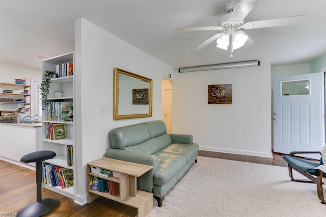 8140 Kenwood Dr, Norfolk, VA 23518 - living area with ceiling fan, wood finished floors, baseboards, and arched walkways