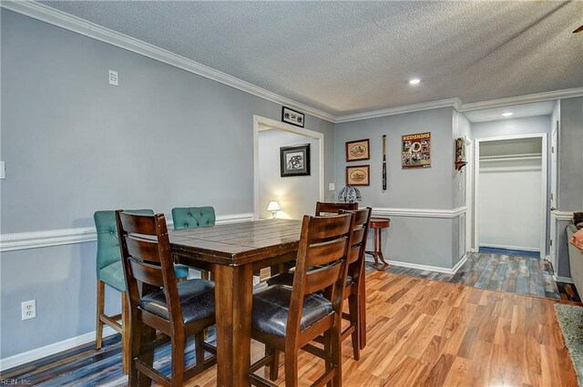 3582 Tennessee Ave, Norfolk, VA 23502 - dining area featuring a textured ceiling, ornamental molding, wood finished floors, baseboards, and recessed lighting