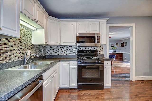 3582 Tennessee Ave, Norfolk, VA 23502 - kitchen featuring stainless steel appliances, a sink, white cabinets, and crown molding