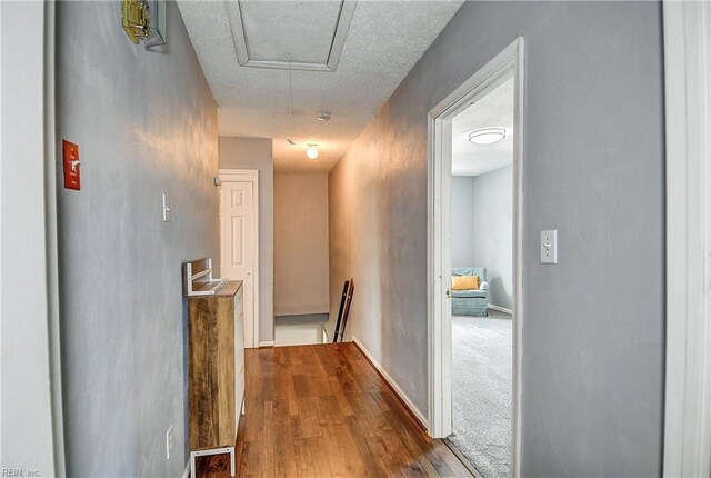 3582 Tennessee Ave, Norfolk, VA 23502 - hallway featuring attic access, dark wood-style floors, baseboards, and an upstairs landing
