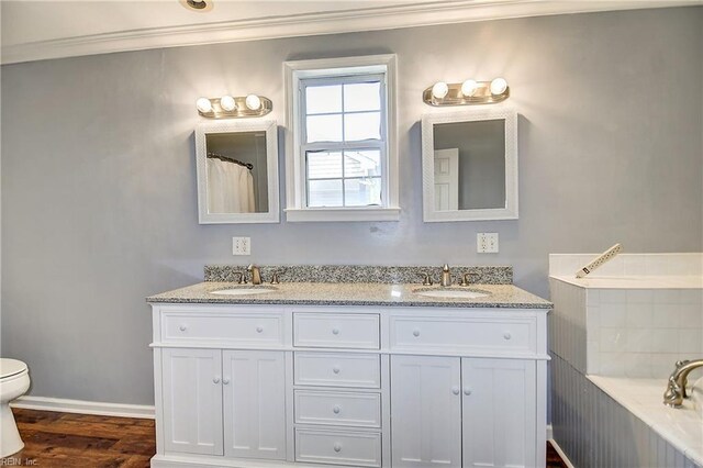 3582 Tennessee Ave, Norfolk, VA 23502 - full bath with ornamental molding, wood finished floors, double vanity, a bathtub, and toilet