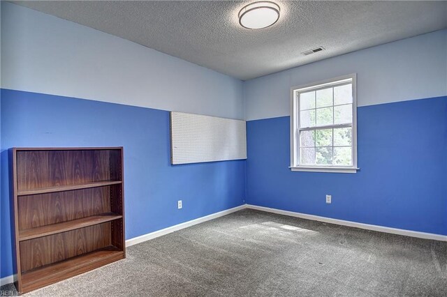 3582 Tennessee Ave, Norfolk, VA 23502 - carpeted empty room featuring a textured ceiling and baseboards