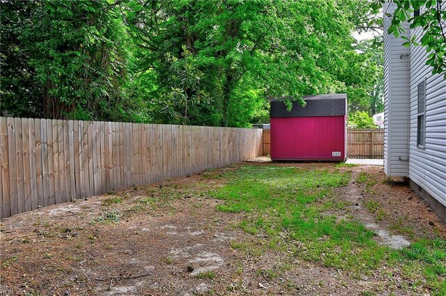 3582 Tennessee Ave, Norfolk, VA 23502 - fenced backyard featuring a storage unit and an outbuilding