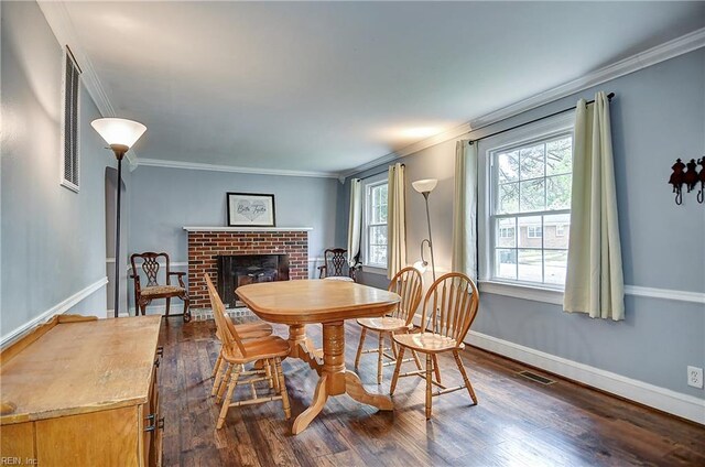 3582 Tennessee Ave, Norfolk, VA 23502 - dining space featuring dark wood-type flooring, a fireplace, ornamental molding, and baseboards