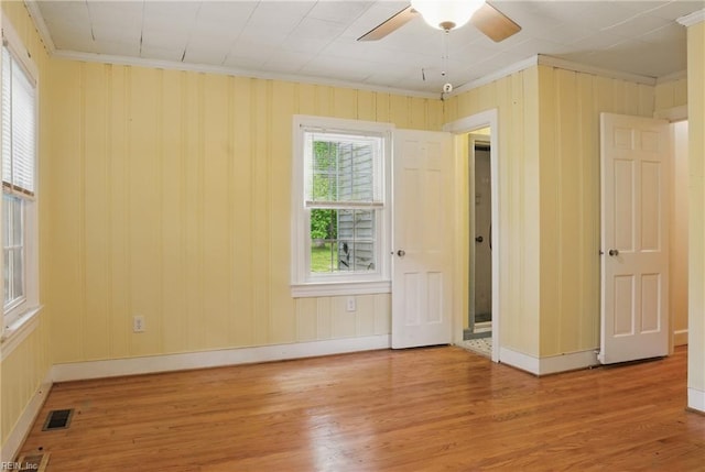 116 Sycamore Rd, Franklin, VA 23851 - spare room featuring crown molding, wood finished floors, a ceiling fan, and baseboards