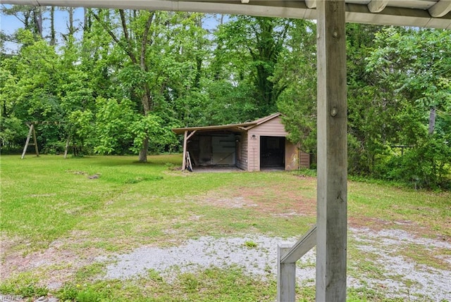 116 Sycamore Rd, Franklin, VA 23851 - view of green lawn featuring an outdoor structure and a pole building