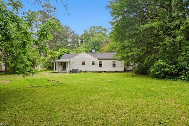 116 Sycamore Rd, Franklin, VA 23851 - rear view of property with central AC, a yard, and a chimney
