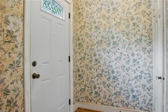 116 Sycamore Rd, Franklin, VA 23851 - entryway with wallpapered walls, baseboards, and wood finished floors