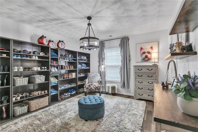 107 Hamilton Ct, Suffolk, VA 23435 - living area with a chandelier, wood finished floors, and baseboards