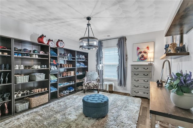 107 Hamilton Ct, Suffolk, VA 23435 - sitting room featuring a chandelier, wood finished floors, and baseboards