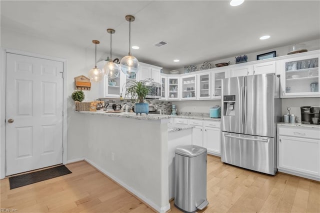 107 Hamilton Ct, Suffolk, VA 23435 - kitchen featuring stainless steel fridge with ice dispenser, light wood-style floors, white cabinets, a peninsula, and glass insert cabinets