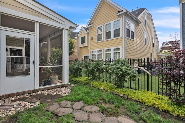 107 Hamilton Ct, Suffolk, VA 23435 - view of property exterior featuring fence and a sunroom