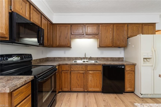 25 Hunter Trce, Hampton, VA 23669 - kitchen with black appliances, a sink, light wood finished floors, brown cabinetry, and dark countertops
