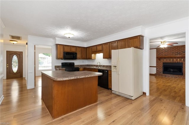 25 Hunter Trce, Hampton, VA 23669 - kitchen with black appliances, a sink, ceiling fan, a kitchen island, and light wood-type flooring