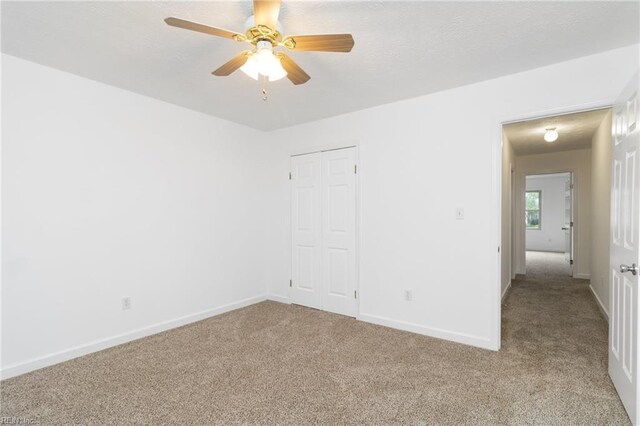 25 Hunter Trce, Hampton, VA 23669 - unfurnished bedroom with carpet flooring, baseboards, a closet, and a ceiling fan