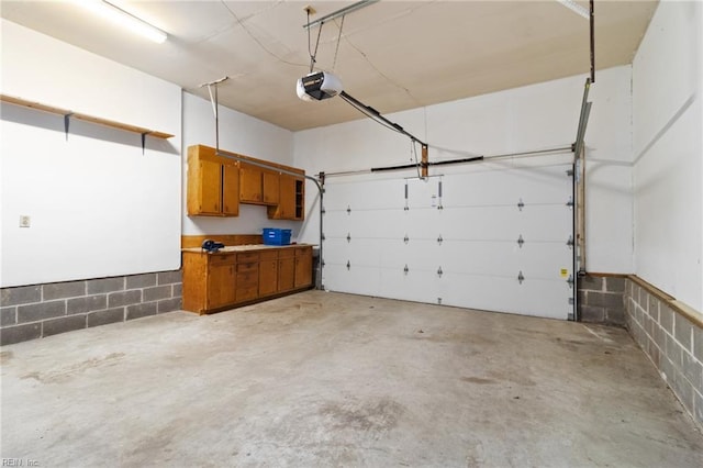 25 Hunter Trce, Hampton, VA 23669 - garage featuring a garage door opener and concrete block wall