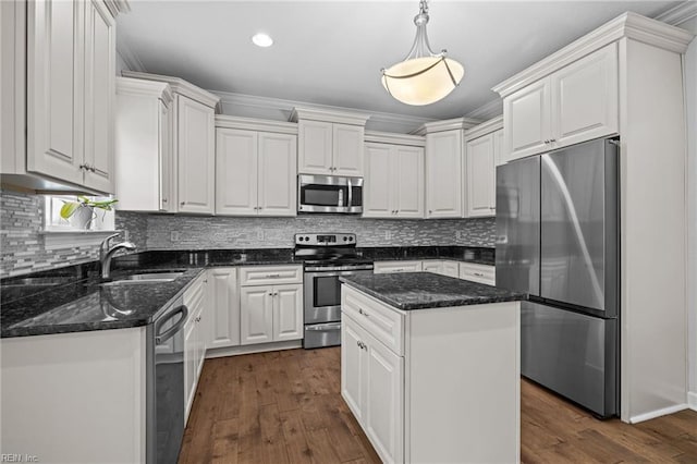 3925 Grand Isle Dr, Chesapeake, VA 23323 - kitchen with stainless steel appliances, a sink, white cabinets, dark wood-type flooring, and backsplash