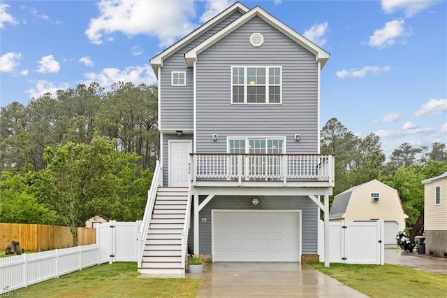 1430 Poquoson Ave, Poquoson, VA 23662 - raised beach house with a gate, stairs, driveway, and an attached garage