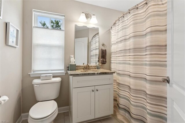 1430 Poquoson Ave, Poquoson, VA 23662 - full bath with vanity, toilet, tile patterned floors, and baseboards