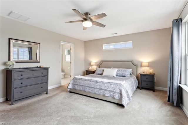1430 Poquoson Ave, Poquoson, VA 23662 - bedroom featuring light carpet, baseboards, and ensuite bath