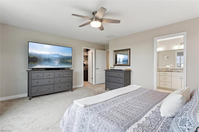 1430 Poquoson Ave, Poquoson, VA 23662 - bedroom featuring light carpet, a walk in closet, baseboards, and ceiling fan