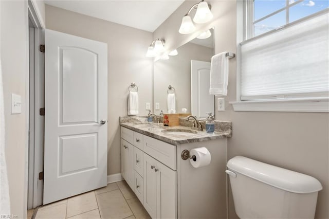 1430 Poquoson Ave, Poquoson, VA 23662 - bathroom featuring double vanity, toilet, and tile patterned flooring