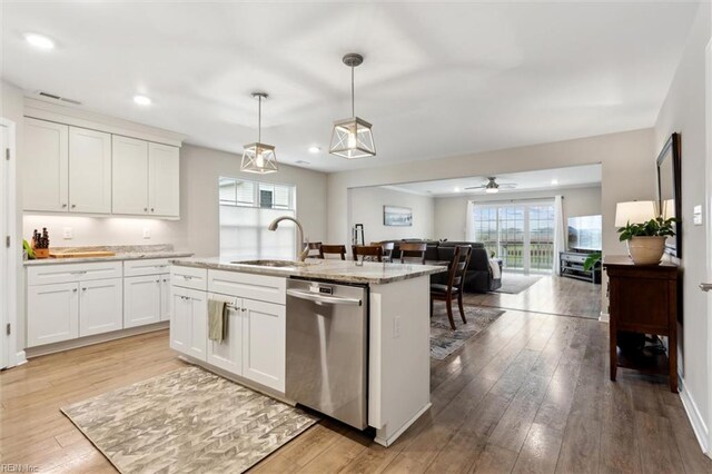 1430 Poquoson Ave, Poquoson, VA 23662 - kitchen featuring dishwasher, a sink, light wood-style floors, white cabinets, and recessed lighting