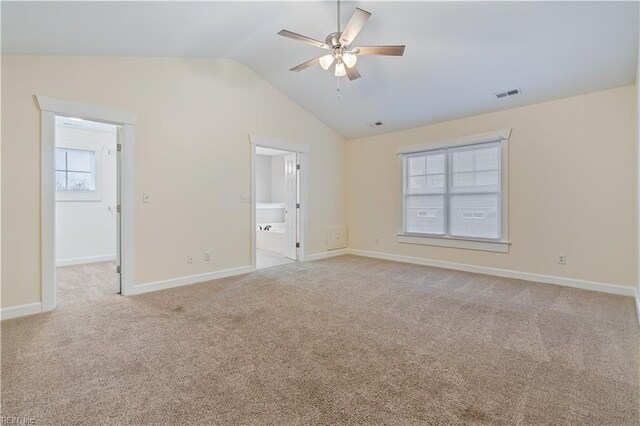 1278 Little Bay Ave Unit B, Norfolk, VA 23503 - unfurnished bedroom with vaulted ceiling, light carpet, a walk in closet, connected bathroom, and baseboards