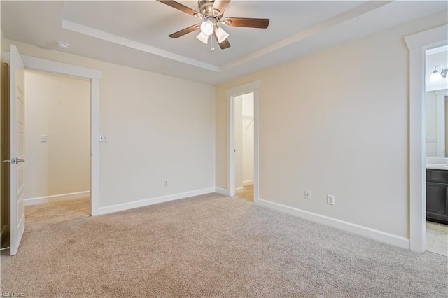 1278 Little Bay Ave Unit B, Norfolk, VA 23503 - unfurnished bedroom featuring a raised ceiling, light colored carpet, baseboards, and connected bathroom