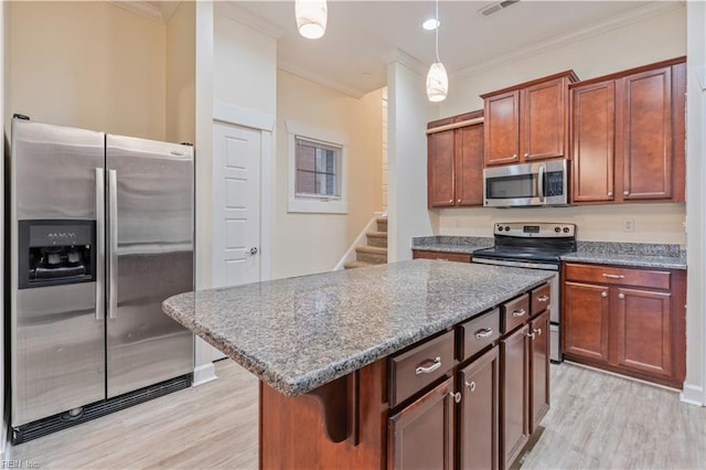 1278 Little Bay Ave Unit B, Norfolk, VA 23503 - kitchen with appliances with stainless steel finishes, crown molding, light wood-type flooring, hanging light fixtures, and a kitchen island