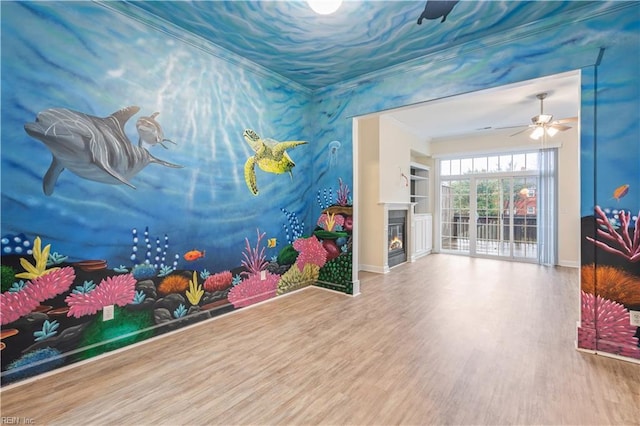 1278 Little Bay Ave Unit B, Norfolk, VA 23503 - playroom with wood finished floors, baseboards, crown molding, ceiling fan, and a warm lit fireplace