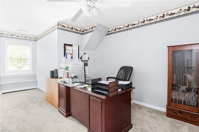 office space with light colored carpet and a ceiling fan
