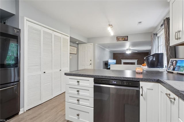 155 Wilderness Rd, Hampton, VA 23669 - kitchen with a peninsula, ceiling fan, and white cabinetry
