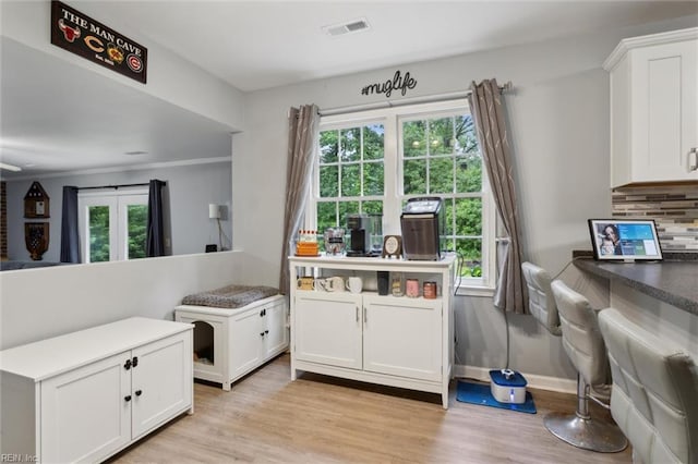 155 Wilderness Rd, Hampton, VA 23669 - kitchen featuring plenty of natural light, white cabinets, and light wood-style floors