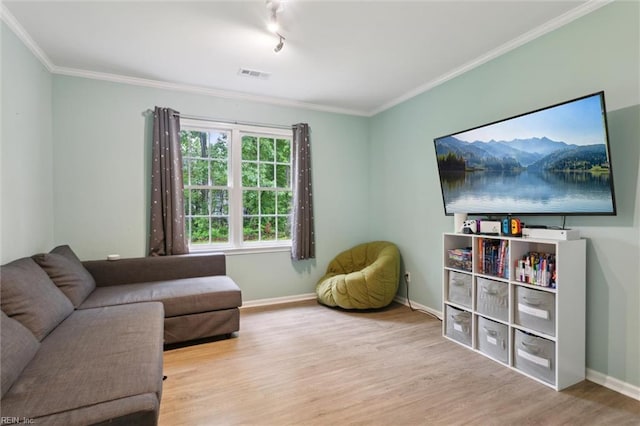155 Wilderness Rd, Hampton, VA 23669 - living room featuring wood finished floors, crown molding, and baseboards