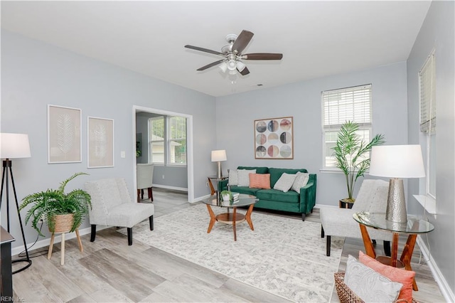 1060 Fairgrounds Ln, Suffolk, VA 23434 - living room featuring a ceiling fan, baseboards, and light wood finished floors