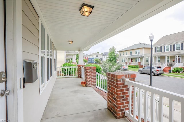 1060 Fairgrounds Ln, Suffolk, VA 23434 - view of patio with a porch and a residential view