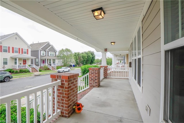 1060 Fairgrounds Ln, Suffolk, VA 23434 - view of patio featuring a porch and a residential view