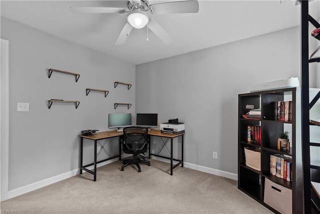 office with carpet flooring, a ceiling fan, and baseboards