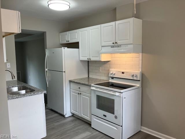 12765 Woodside Ln, Newport News, VA 23602 - kitchen with white appliances, under cabinet range hood, light wood-type flooring, a sink, and white cabinetry