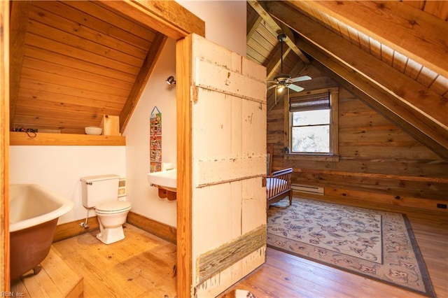 bathroom with hardwood / wood-style flooring, toilet, wood ceiling, wooden walls, and baseboards