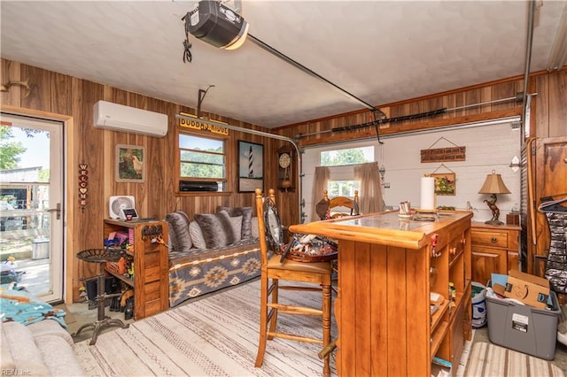 kitchen with wooden walls and a wall unit AC